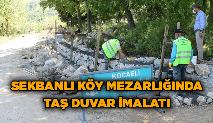 Sekbanlı köy mezarlığında taş duvar imalatı