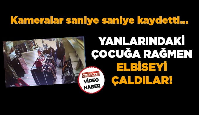 Yanlarındaki çocuğa rağmen elbise çaldılar! Kameralar saniye saniye…